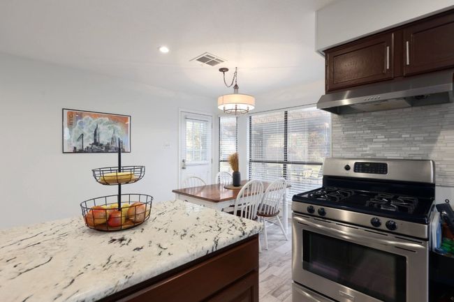 This kitchen is so open and inviting that you’ll never feel isolated from the rest of the house, making it the perfect spot to cook, entertain, or enjoy a meal with family or friends | Image 11
