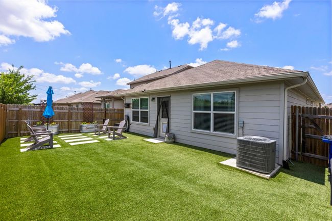Back of property featuring a fenced backyard and a shingled roof | Image 26