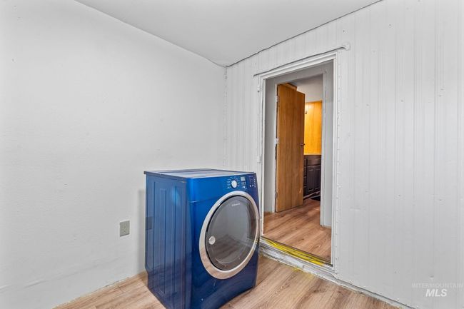 Laundry room with washer / clothes dryer and wood finished floors | Image 18