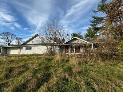 View of front of house featuring a garage | Image 3