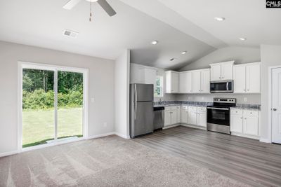 The large family room is located directly off the kitchen, allowing for plenty of room to entertain. | Image 3