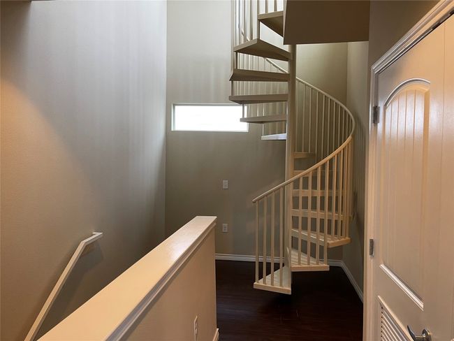 Stairway with wood finished floors and baseboards | Image 21