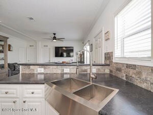 623 Hyacinth Cir, House other with 3 bedrooms, 2 bathrooms and null parking in Barefoot Bay FL | Image 18