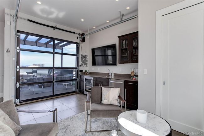 Custom glass remote controlled garage for unobstructed views | Image 17
