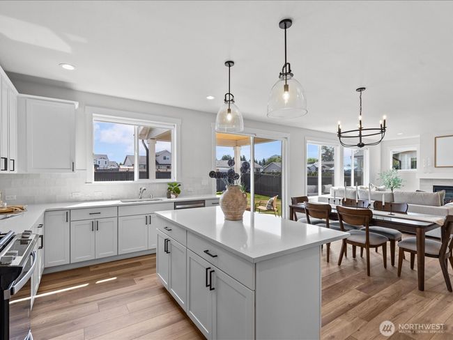 natural lighting open concept kitchen and living room | Image 15