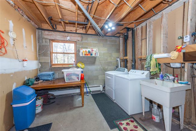 Basement with concrete block wall and independent washer and dryer | Image 40