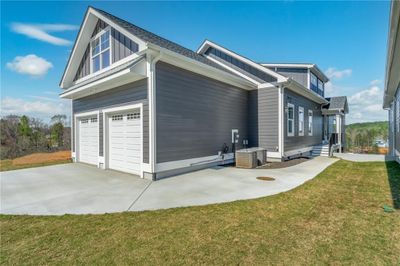 Two Car Attached Garage and Golf Cart Parking Oad | Image 2