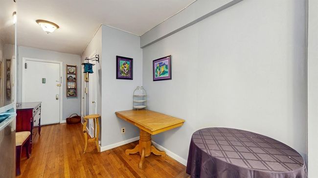Corridor with wood finished floors and baseboards | Image 9