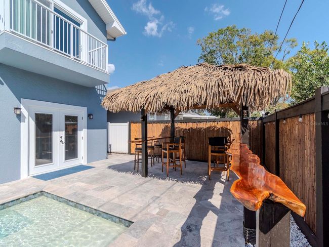 BACK YARD WITH TIKI BAR AND SALT WATER POOL | Image 31