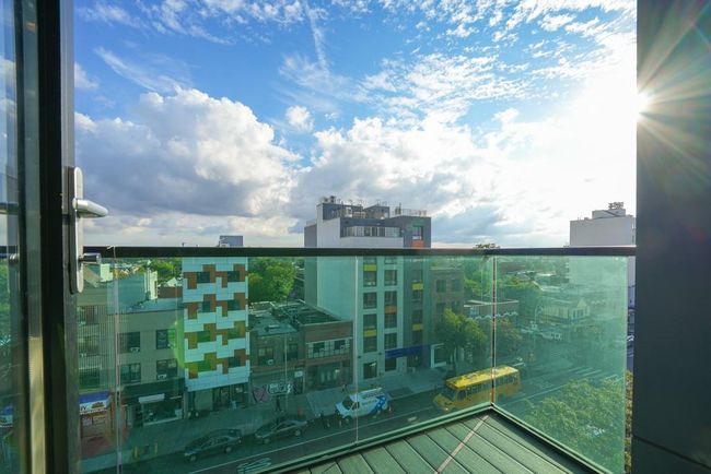 Balcony with a view of city | Image 8