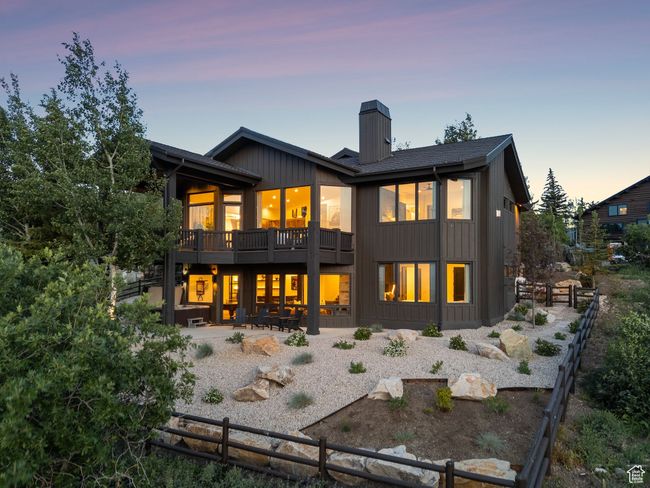 Back of house with a chimney and a patio | Image 89