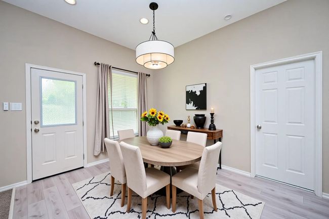 Virtual staging. Experience modern elegance in this beautifully breakfast area, featuring chic decor, abundant natural light, and a welcoming atmosphere. Perfect for entertaining and family gatherings. | Image 17