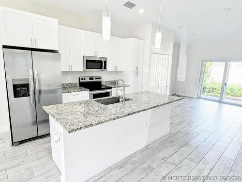 1562 W 26th Ct, Riviera Beach, FL, 33404-4172 | Card Image