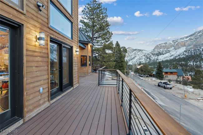 Wooden terrace featuring a mountain view | Image 77