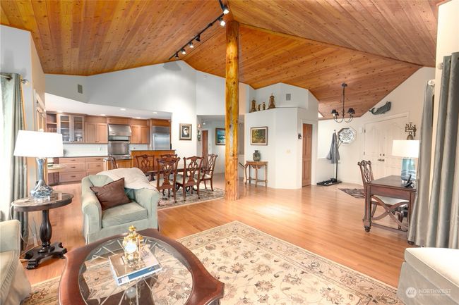 Unique construction with center log pole from the oak hardwood flooring to the vaulted wood vaulted ceilings to enjoy the open and spacious living areas | Image 20