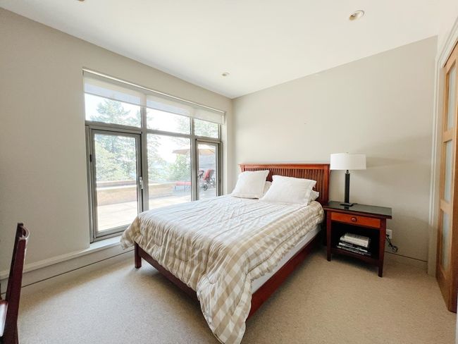Bedroom with access to outside and light carpet | Image 26