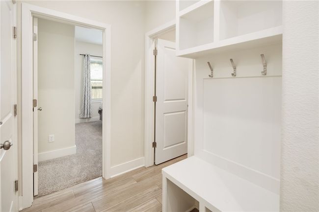 Mudroom with light wood-style flooring and baseboards | Image 18