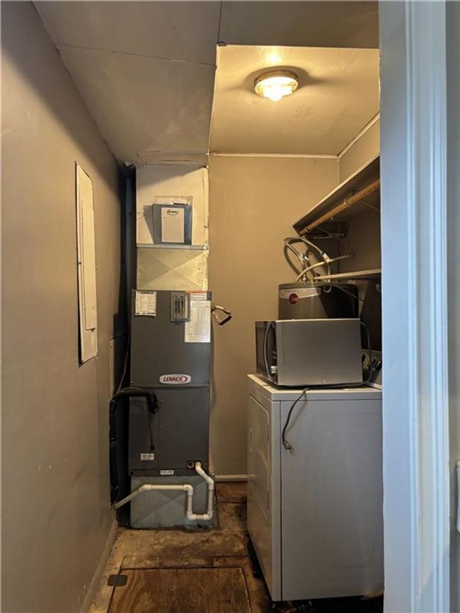 Laundry room featuring laundry area and washer and clothes dryer | Image 31