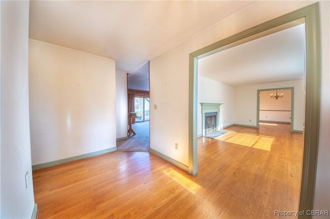 Hall featuring a chandelier and light hardwood / wood-style floors | Image 8
