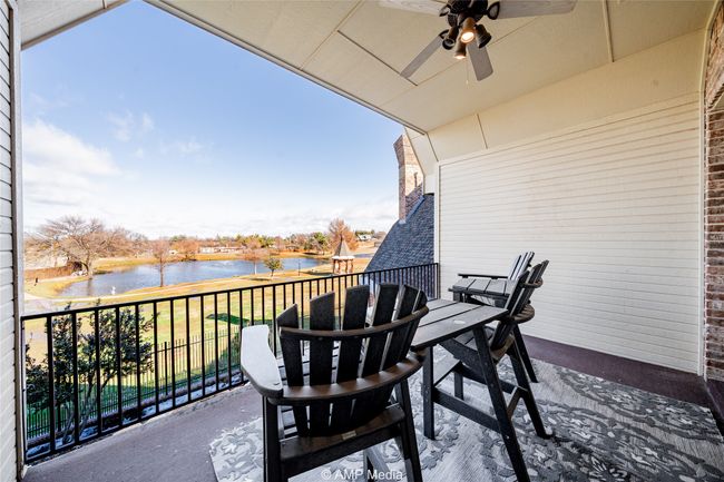 Balcony featuring ceiling fan and a water view | Image 29