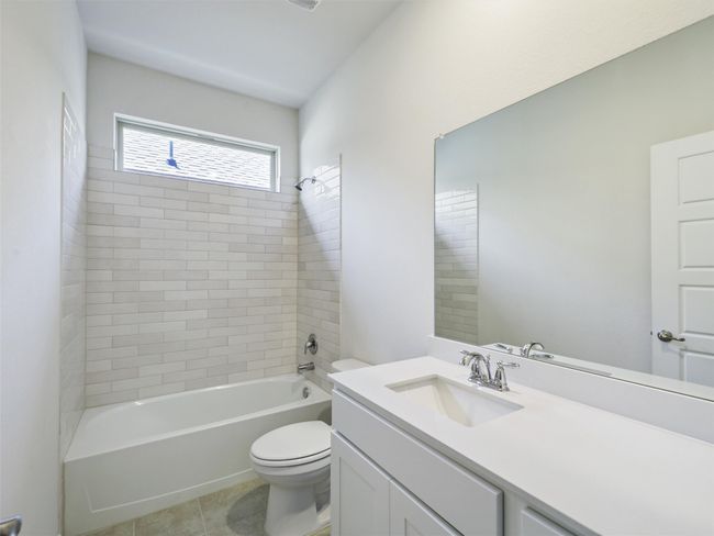 Bathroom featuring vanity, shower combination, and tile patterned flooring | Image 19