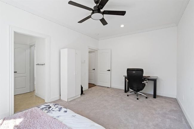 Another view of the secondary bedroom, featuring plush carpet and a Jack and Jill bathroom, designed for shared living with comfort and functionality. | Image 37