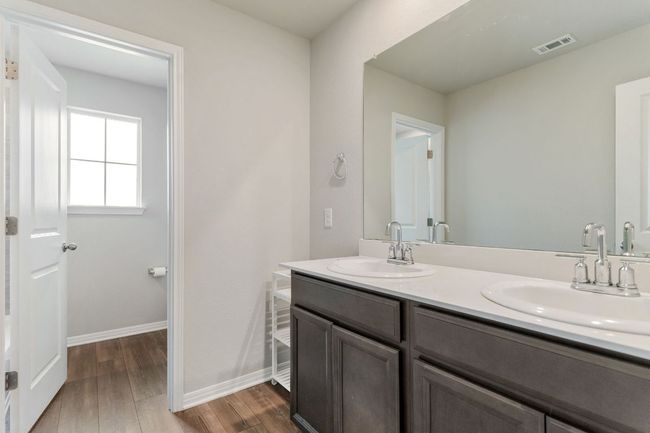 Full bath with double vanity on second floor. | Image 25