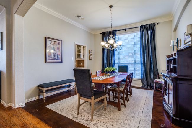 Dining room featuring baseboards & crown molding | Image 6