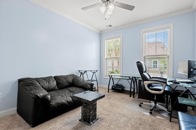 Carpeted office space with ornamental molding and ceiling fan | Image 20