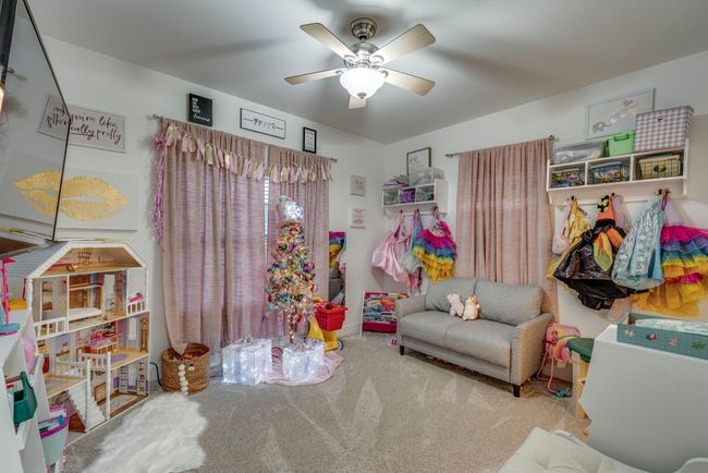 Bedroom room with carpet and ceiling fan | Image 16