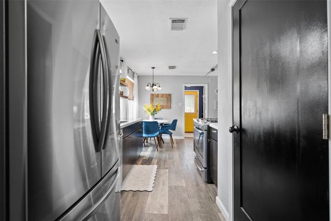 View exiting dining room into the kitchen. | Image 19