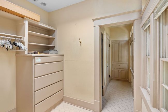 Spacious closet with light tile patterned floors | Image 26