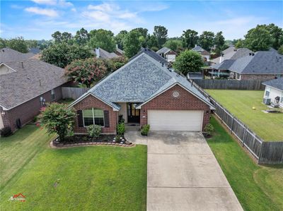 View of front of property featuring a beautifully landscaped yard. | Image 1