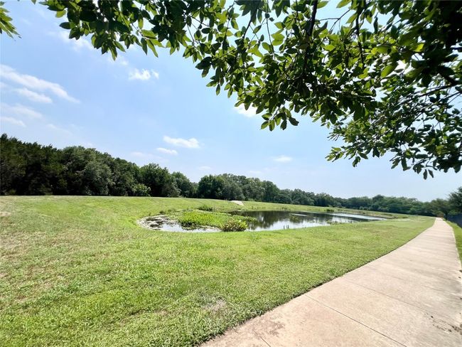 View of grassy yard featuring a water view | Image 20