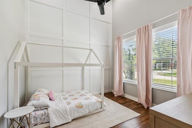 Home office/study is currently being used as a bedroom. This room features a board and batten wall. | Image 24