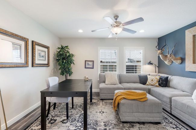 1st Floor Bedroom #2 with closet used as an Office/Living Room with a ceiling fan, recessed lighting, baseboards, and wood finished floors | Image 27