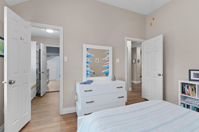 Bedroom featuring light wood-type flooring and baseboards | Image 27