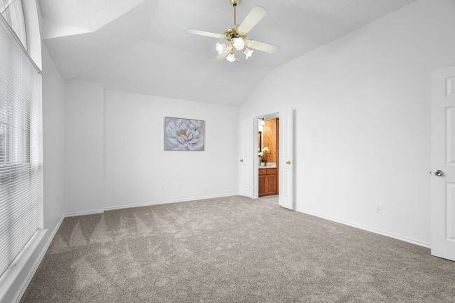 The primary bedroom has a beautiful window and two closets. | Image 26