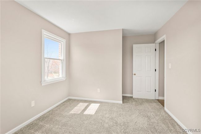 Empty room with baseboards and light carpet | Image 23