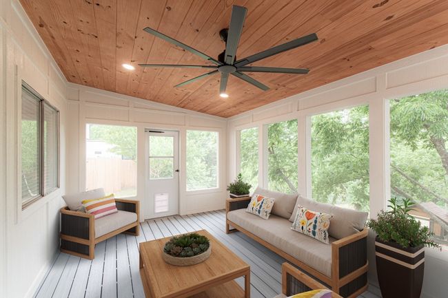 From the kitchen you enter another dining or living space with a screened in porch. | Image 14