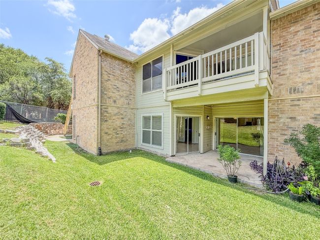 Back of property featuring a patio area, a balcony, and brick siding | Image 29