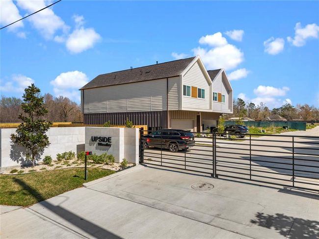 Welcome to Upside Wheatley, a modern gated community offering security, style, and convenience. Experience contemporary living with beautifully designed homes in a private, well-appointed neighborhood. | Image 32
