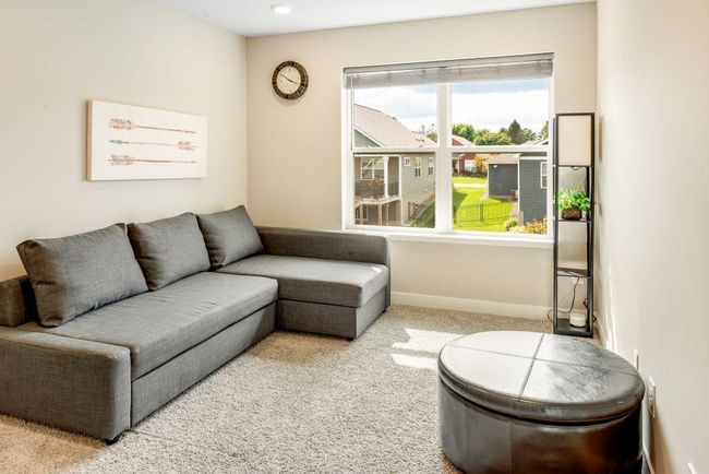 The spacious loft has a ton of uses and also overlooks the backyard. | Image 17