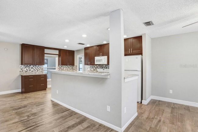 Kitchen with beautiful 42 inch cabinets, granite countertops and beautiful backsplash | Image 5
