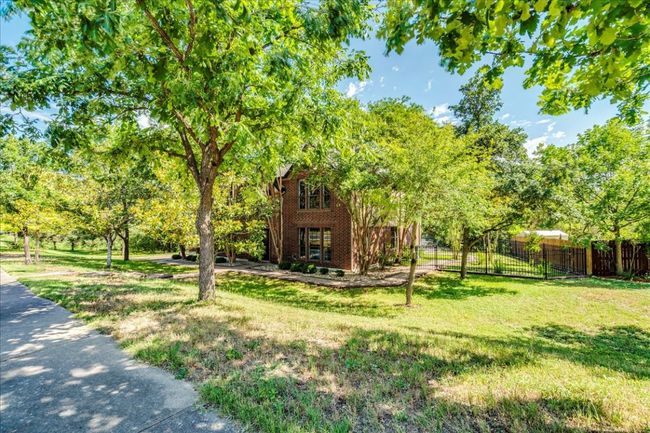 A view of the home from the front sidewalk. | Image 40
