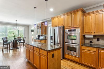 Kitchen With Granite Countertops, Stainless Steel Appliances, Central Island, &amp; Breakfast Room | Image 3