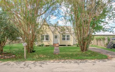 This historic home sits on block and beams with a welcoming path to the front door. New roof was installed in February of this year. | Image 3