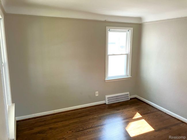 View from front door into living room. Fresh paint & refinished oak flooring. | Image 5