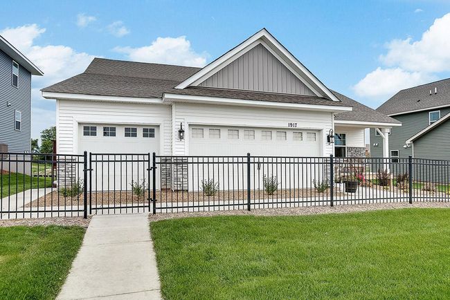 Finnegan Heartland Cottage at Ravine Crossing in Cottage Grove. Photo is of Model home. Shown with optional stone. Options and colors may vary. Ask Sales Agent for details. | Image 42