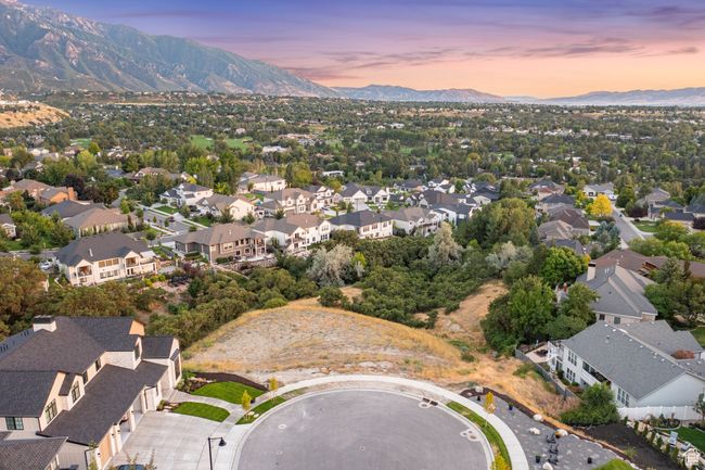 Aerial view of property and surrounding area with mountains and nearby suburban area | Image 7